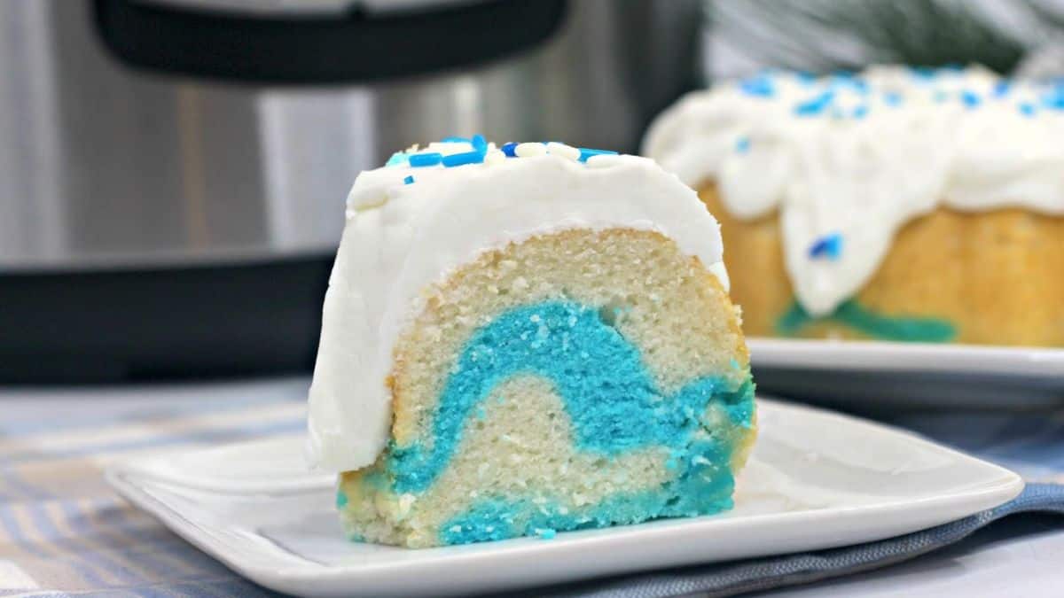 A slice of frozen themed Bundt cake set on a plate.