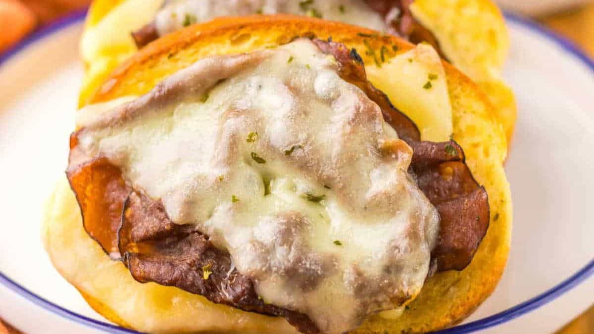Two slices of Garlic Bread French Dips set on a plate. 