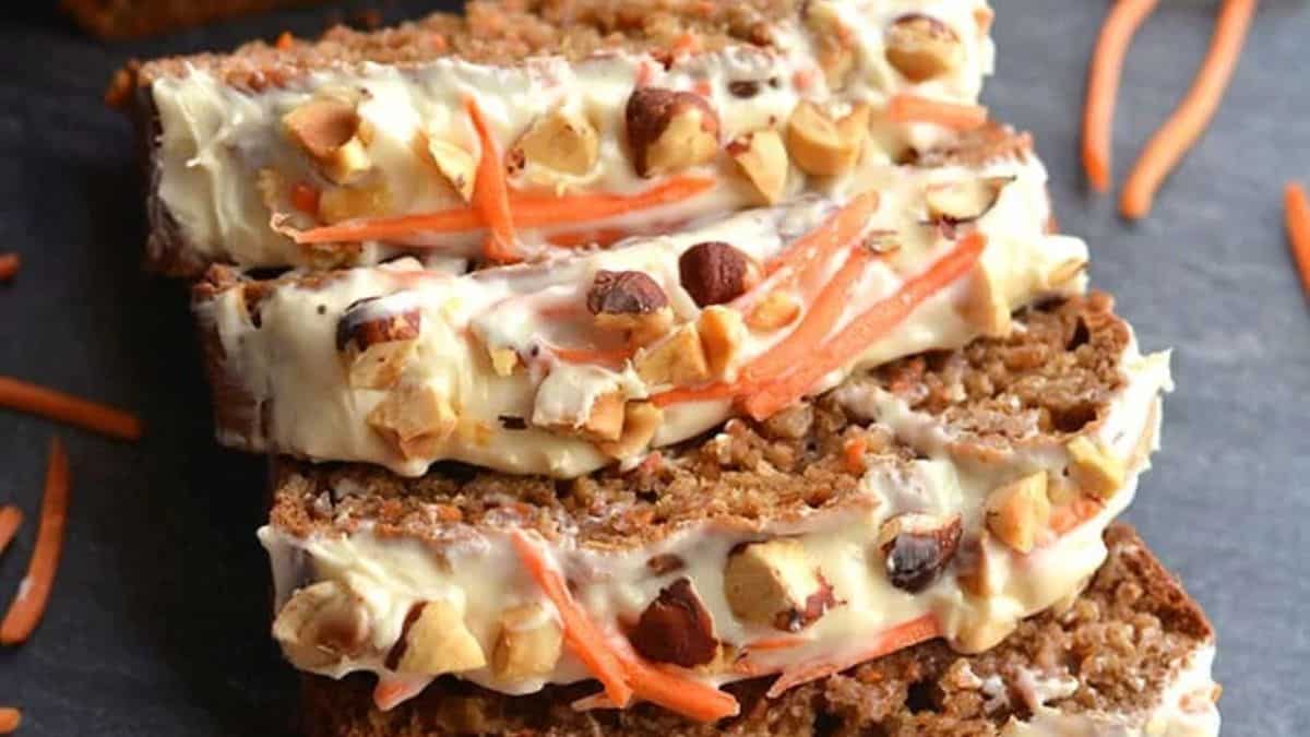 Gluten-free banana carrot cake bread on a cutting board.