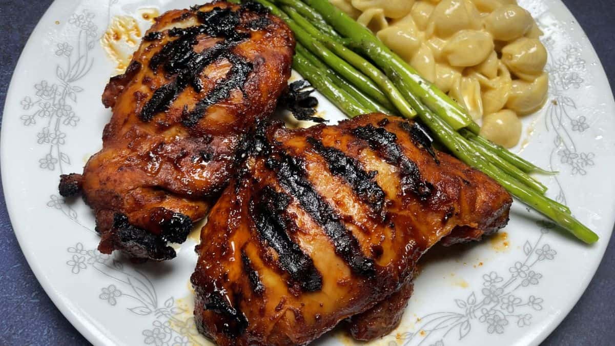 Gochujang chicken with spicy Korean chili glaze and sesame seeds.