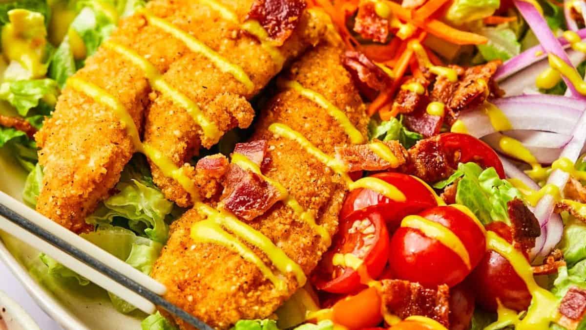 Honey mustard chicken salad with mixed greens and sliced chicken.