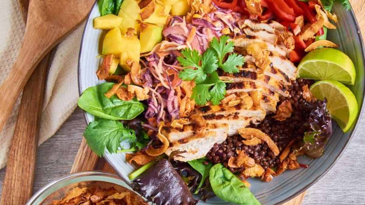 Lentil and mango salad topped with mango coconut lime chicken.