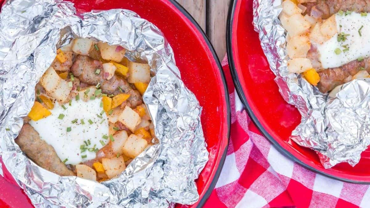 Two plates with lumberjack breakfast foil packs.