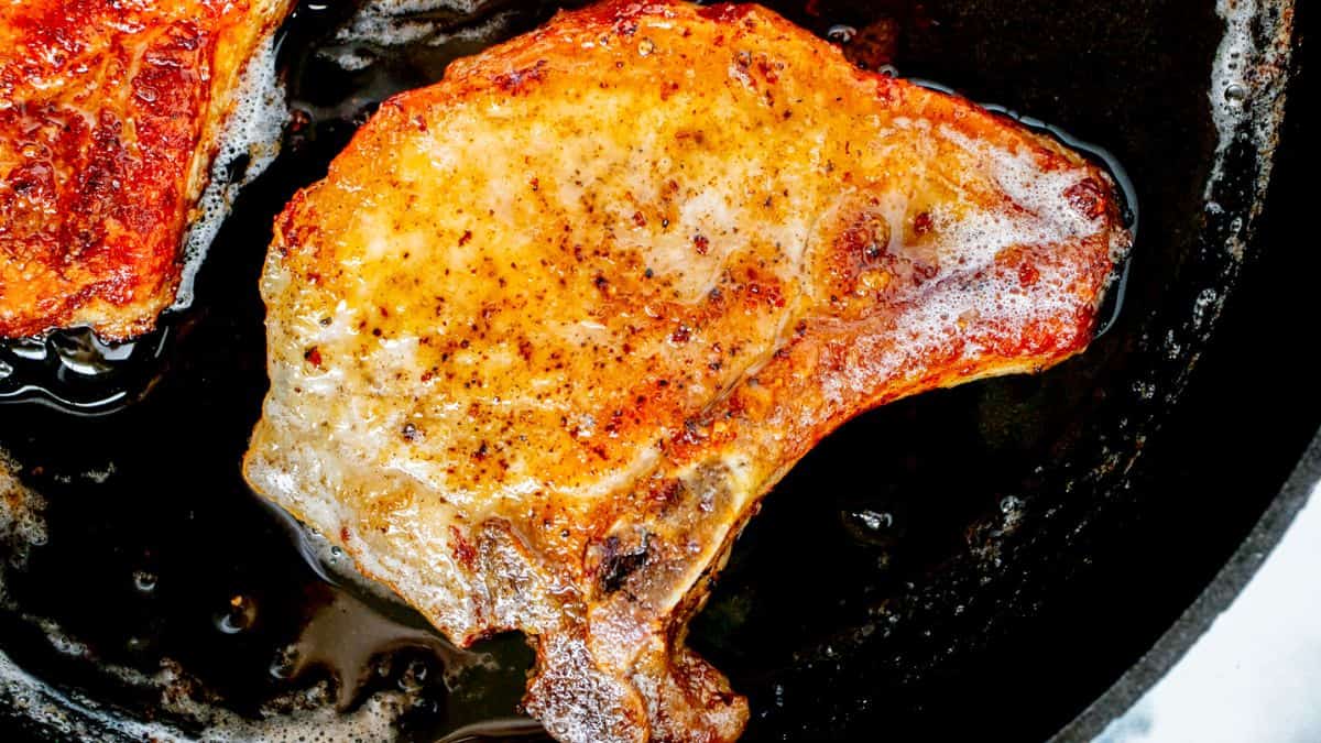 Porkchop slices cooked in a cast iron. 