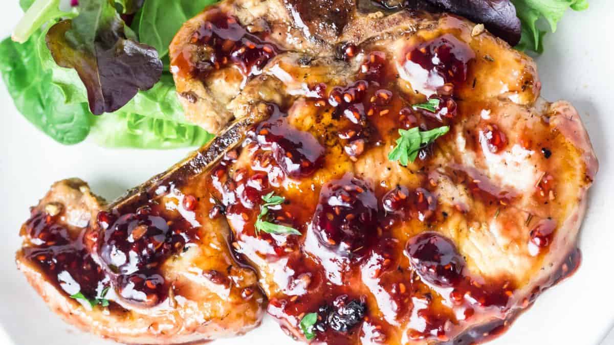 Top shot of a single porkchop cut with raspberry glaze. 