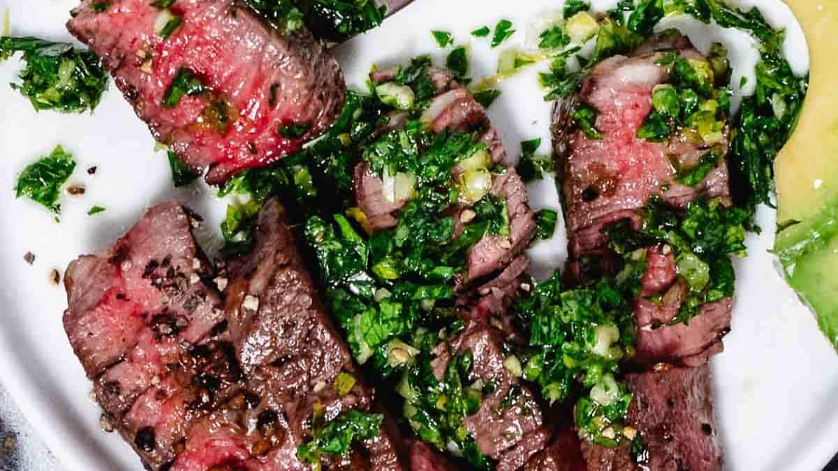 Slices of seared steak with gremolata.