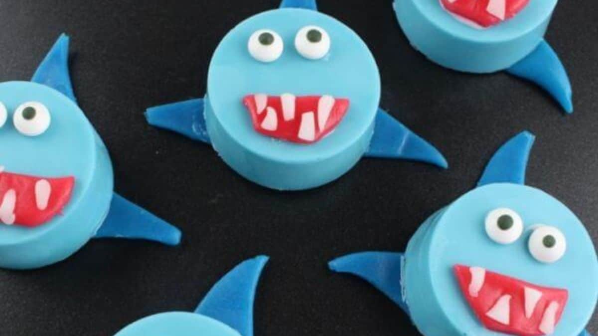 A couple of pieces of Oreo designed as blue sharks.
