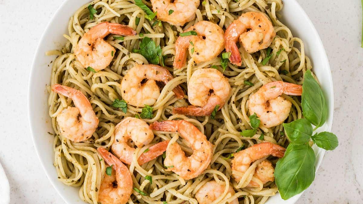 Shrimp pesto pasta with vibrant green pesto and succulent shrimp.
