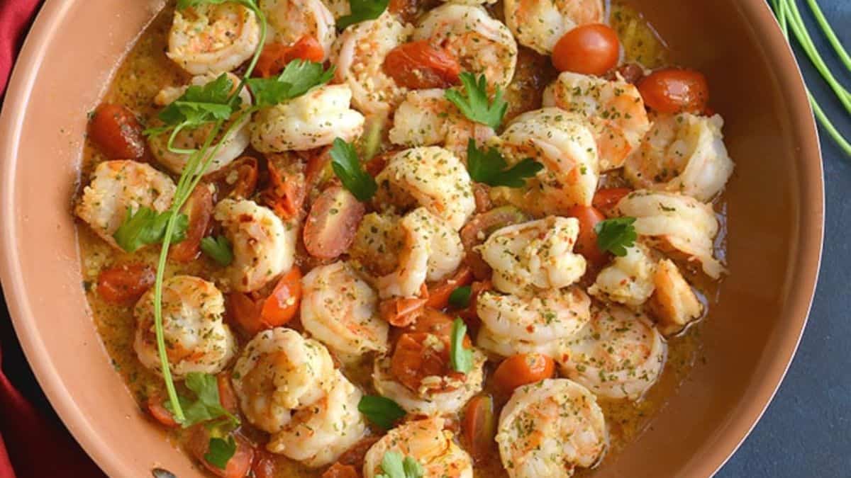 Healthy shrimp scampi served over roasted spaghetti squash with herbs.