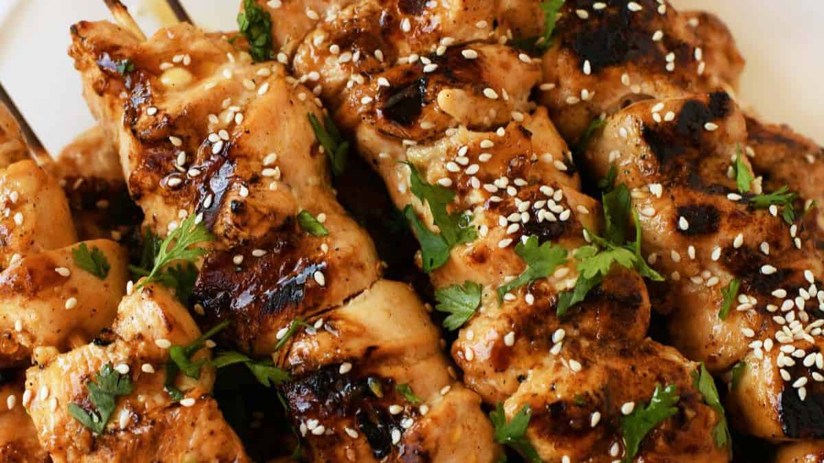 Grilled ginger chicken skewers with fresh herbs and a ginger glaze.