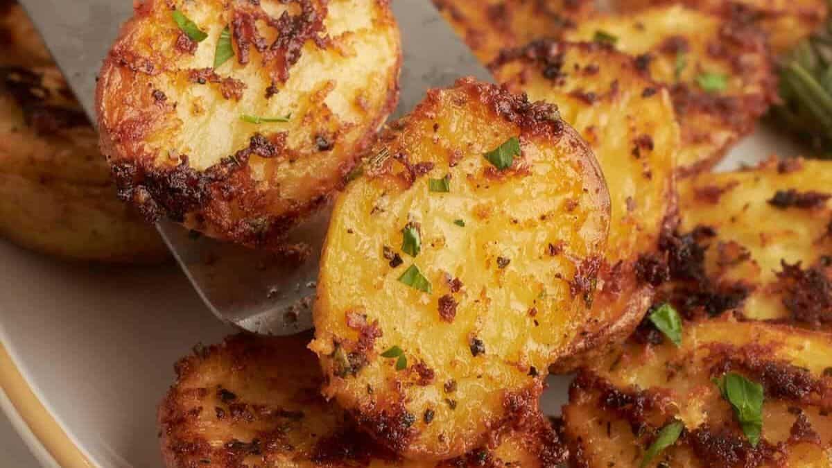 Close-up shot of a couple of pieces of crusted potatoes. 
