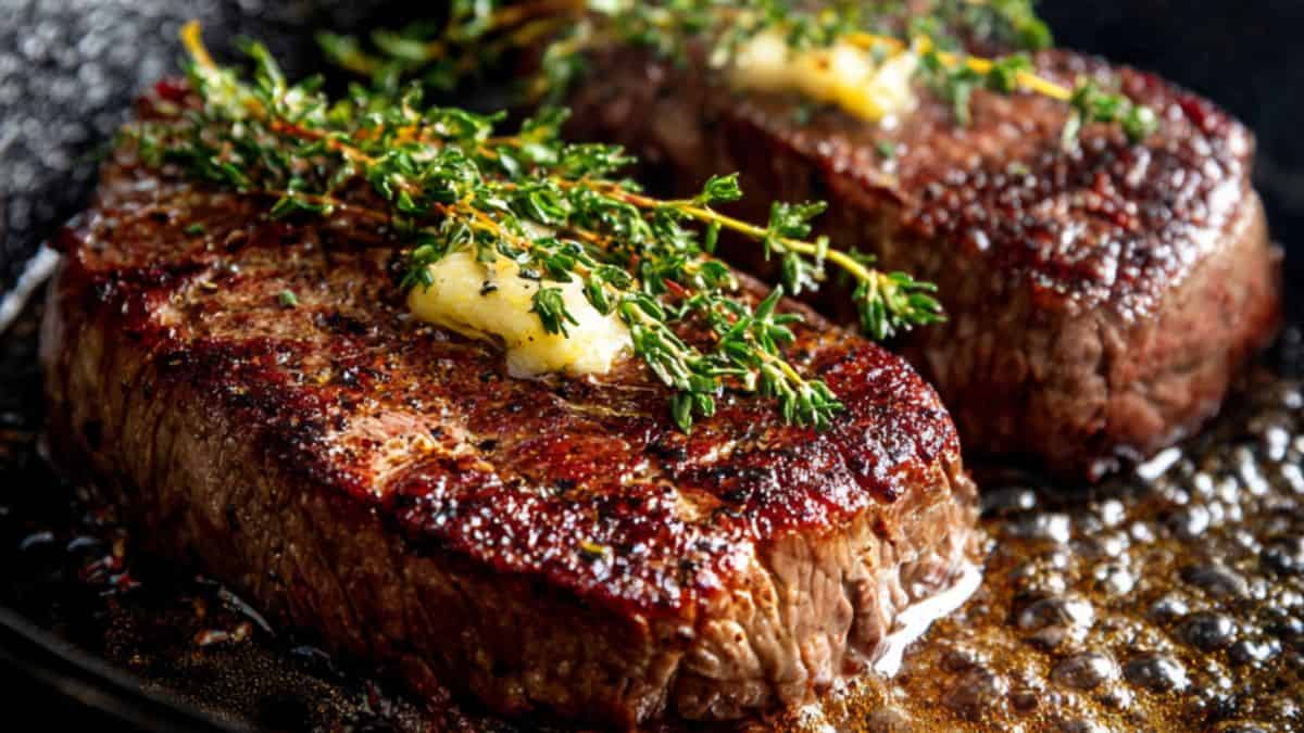 Two pieces of streak cooked in cast iron with butter and rosemary.