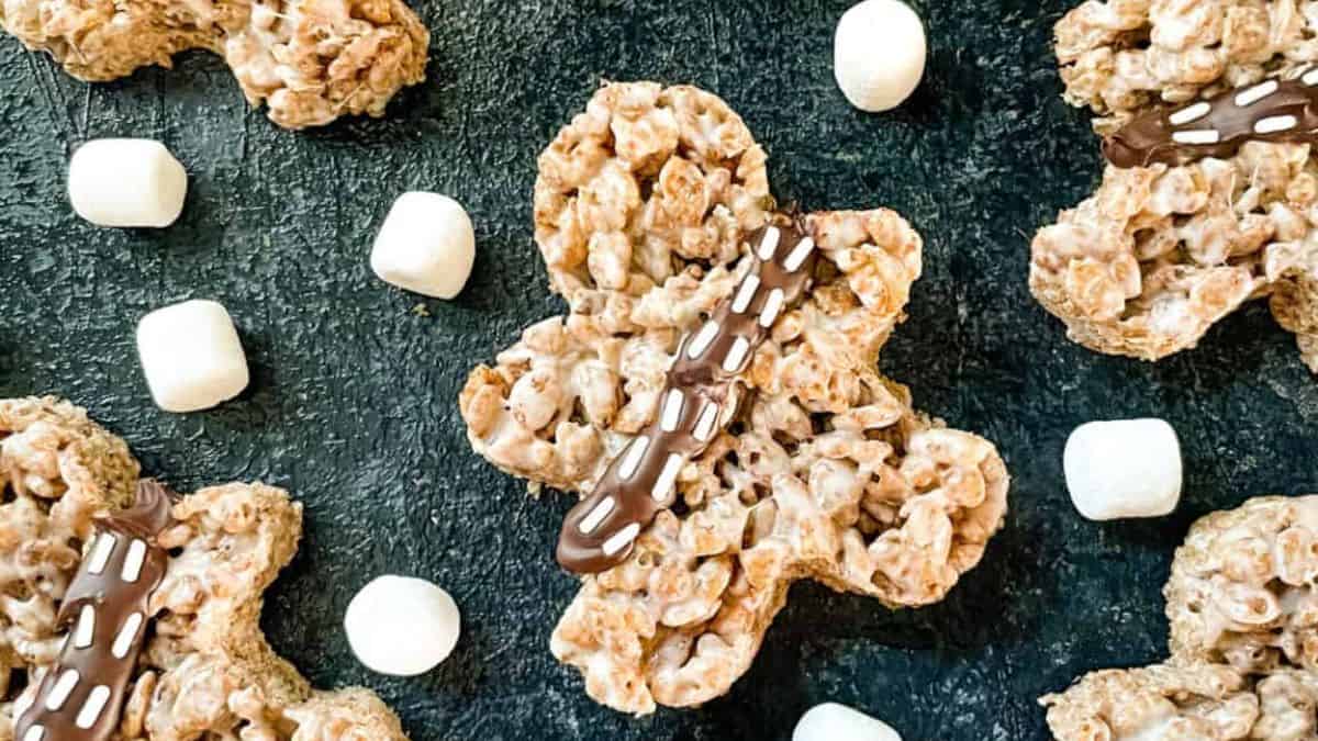 A photo of a couple of Chewbacca Rice Krispies with small marshmallows set on a flat surface.