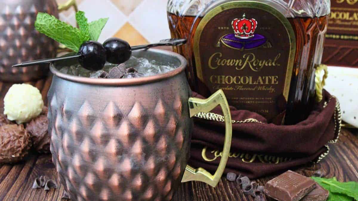 A serving of Chocolate Mule Kentucky. A bottle of Crown Royal Chocolate in the background. 
