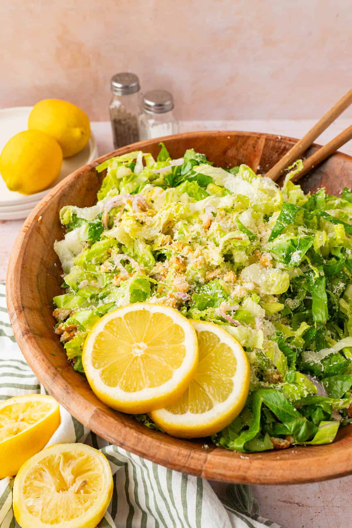 The lemon parmesan salad in a wooden serving bowl. 