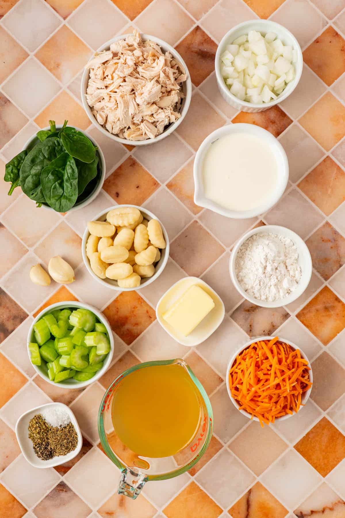The ingredients to make chicken gnocchi soup that is a copycat version of Olive Garden. 